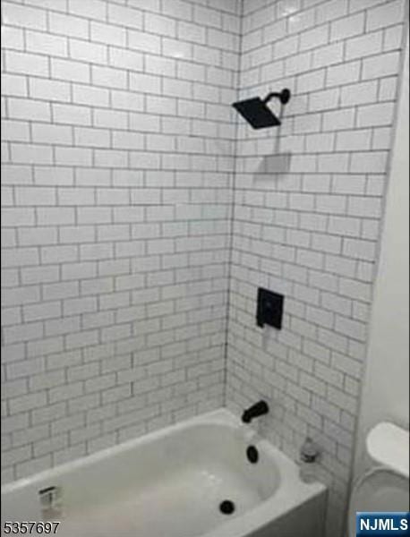 full bath with  shower combination and toilet