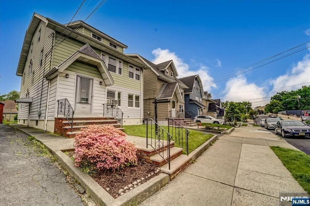 view of front of home with a residential view