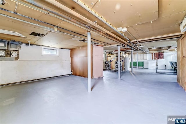 below grade area featuring washing machine and dryer