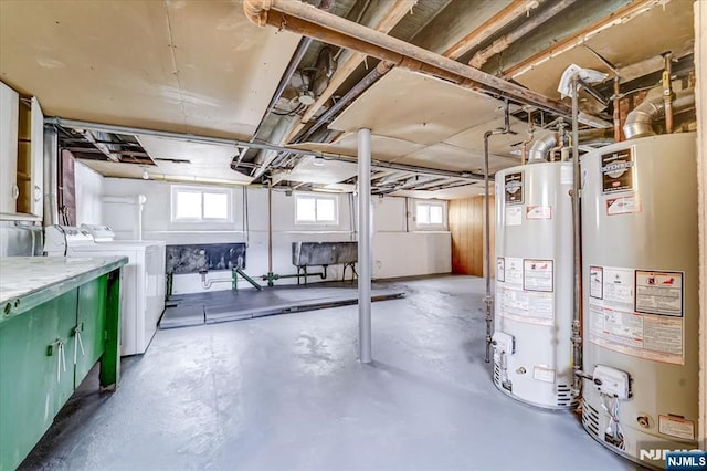 below grade area with gas water heater and independent washer and dryer