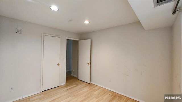700 Schuyler Unit D16, Kearny, NJ 07032 - unfurnished bedroom with recessed lighting, light wood-type flooring, and baseboards