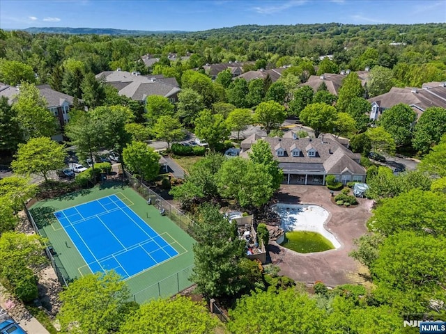 aerial perspective of suburban area featuring a forest