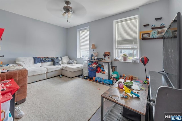 10 Orchard St, Elmwood Park, NJ 07407 - carpeted living room with a ceiling fan