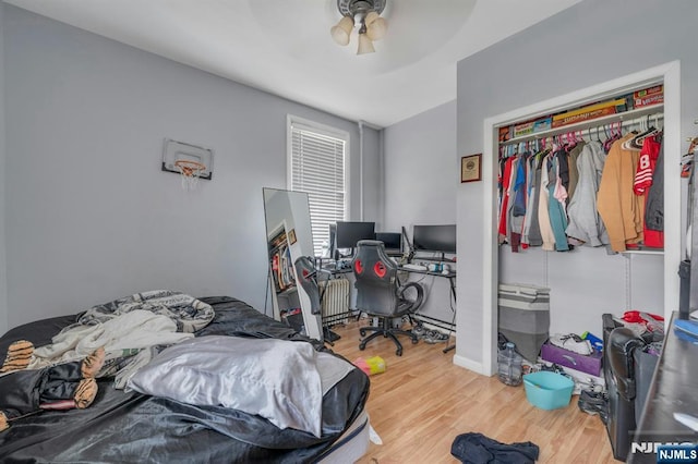 10 Orchard St, Elmwood Park, NJ 07407 - bedroom featuring wood finished floors, a closet, ceiling fan, an office area, and baseboards
