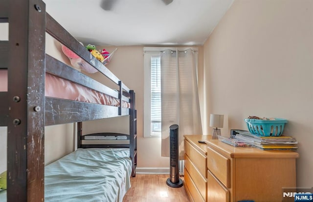 10 Orchard St, Elmwood Park, NJ 07407 - bedroom featuring light wood-type flooring, multiple windows, and baseboards