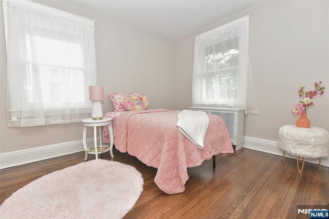228 Ridgefield Ave, Bogota, NJ 07603 - bedroom with wood finished floors, baseboards, and radiator