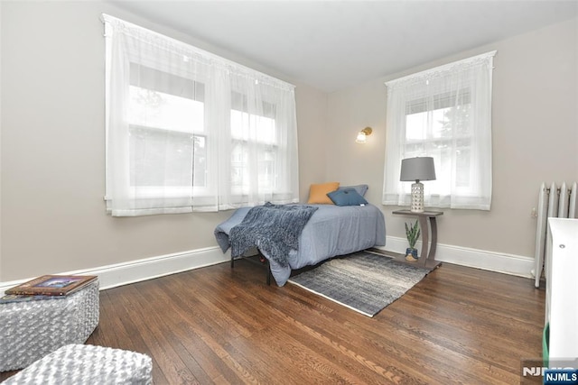 228 Ridgefield Ave, Bogota, NJ 07603 - bedroom featuring radiator heating unit, wood finished floors, and baseboards