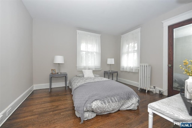 228 Ridgefield Ave, Bogota, NJ 07603 - bedroom with radiator, wood finished floors, and baseboards