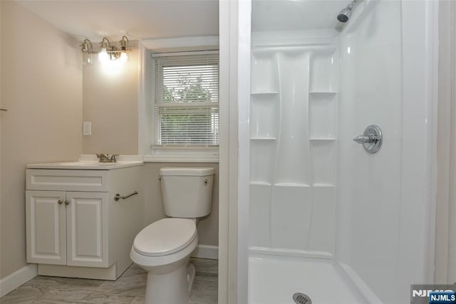 228 Ridgefield Ave, Bogota, NJ 07603 - full bathroom featuring a shower, vanity, toilet, and baseboards