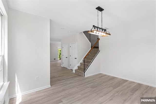 52 Straton Ct Unit 1006, Sayreville, NJ 08859 - foyer with light wood finished floors, baseboards, and stairs