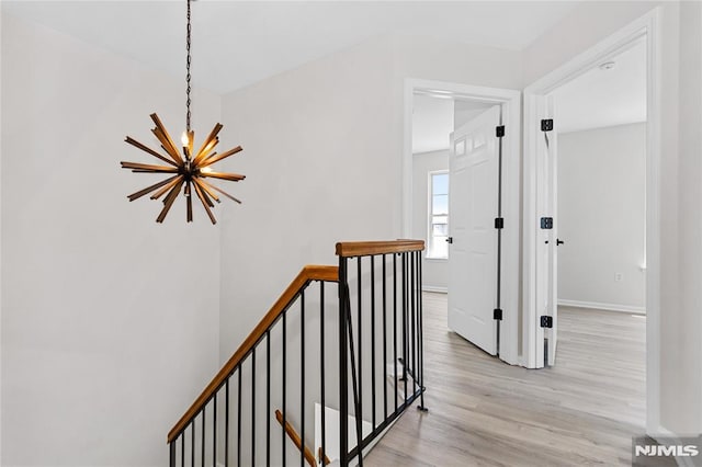 52 Straton Ct Unit 1006, Sayreville, NJ 08859 - staircase featuring a chandelier, wood finished floors, and baseboards