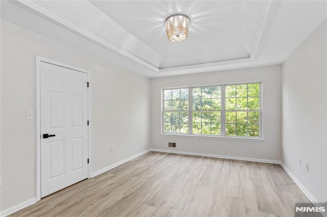 52 Straton Ct Unit 1006, Sayreville, NJ 08859 - unfurnished room featuring plenty of natural light, light wood-style floors, a raised ceiling, and baseboards