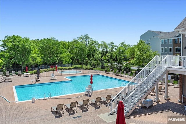 52 Straton Ct Unit 1006, Sayreville, NJ 08859 - community pool featuring a patio area and stairway