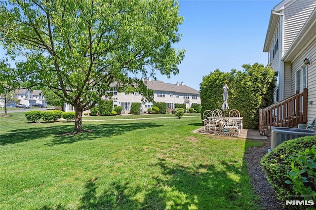 52 Straton Ct Unit 1006, Sayreville, NJ 08859 - view of green lawn with central AC, a patio, and a residential view