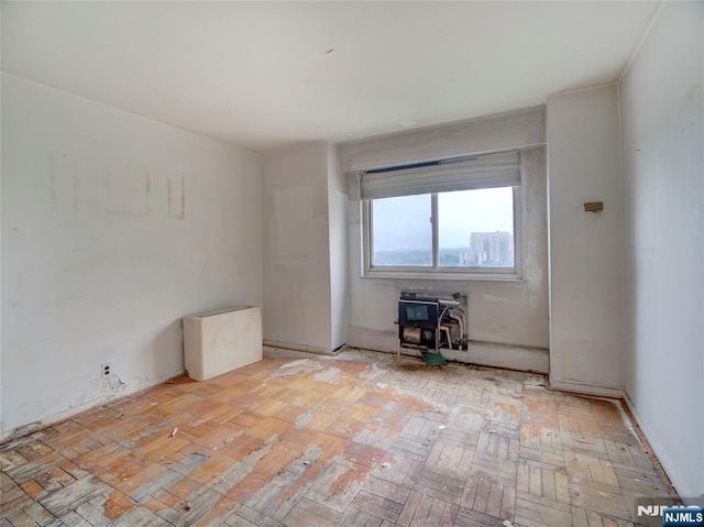 377 S Harrison St Unit 18Aa, East Orange, NJ 07018 - unfurnished room featuring a wood stove