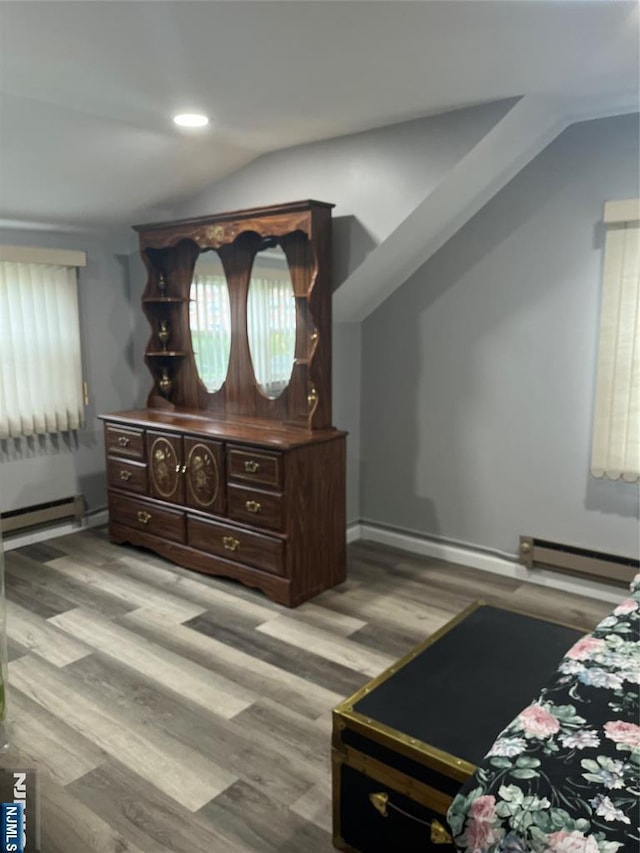 60 Palisades, Bergenfield, NJ 07621 - bedroom with baseboard heating, light wood-style floors, lofted ceiling, and recessed lighting