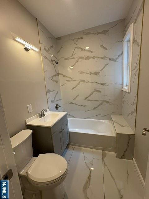 150 W 29th, Bayonne, NJ 07002 - full bath with marble look tiles, toilet, vanity, and tub / shower combination