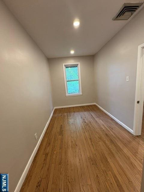 150 W 29th, Bayonne, NJ 07002 - unfurnished room with baseboards, wood finished floors, and recessed lighting