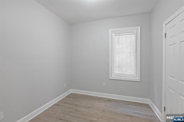 unfurnished room featuring light wood-style floors and baseboards