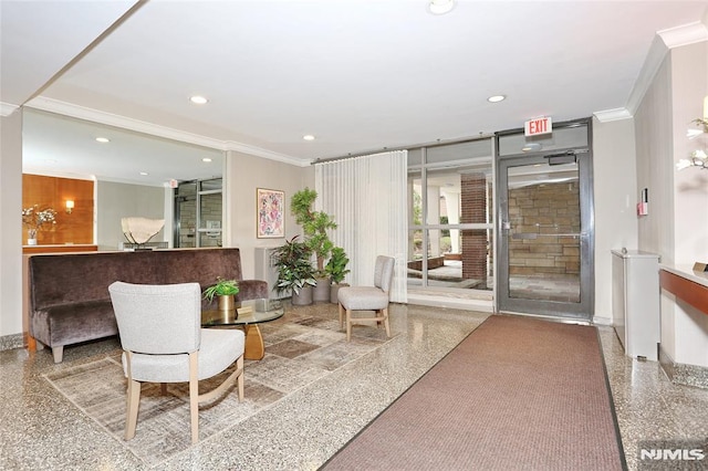 lobby with ornamental molding and recessed lighting