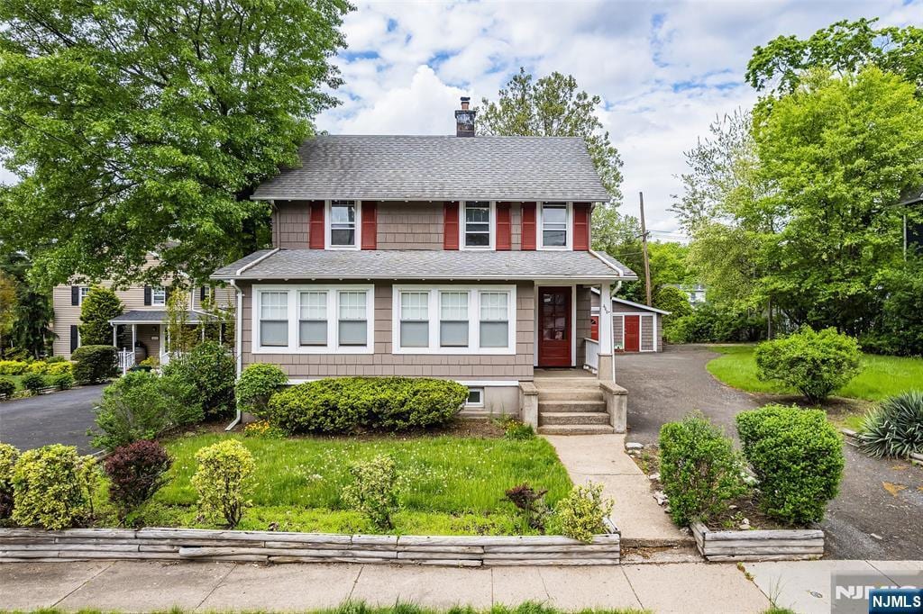 468 Van Buren St, Ridgewood, NJ 07450 - american foursquare style home featuring a shingled roof and a chimney
