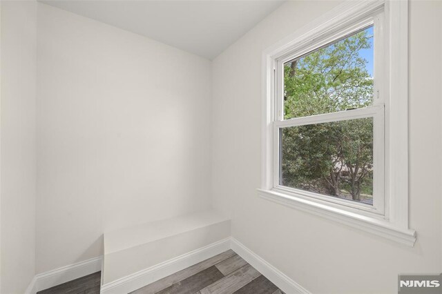 mudroom with baseboards and wood finished floors