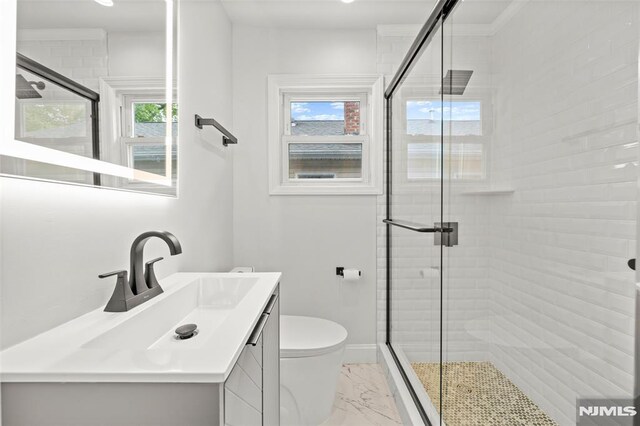 bathroom featuring marble look tiles, a shower stall, toilet, and vanity