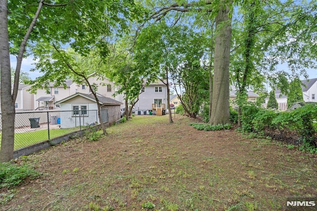 view of yard with fence and a residential view