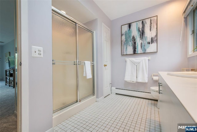 full bath featuring baseboard heating, a shower stall, vanity, and toilet