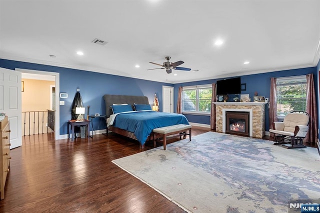 202 Elmwynd Dr, Orange, NJ 07050 - bedroom with ornamental molding, wood finished floors, baseboards, recessed lighting, and a glass covered fireplace