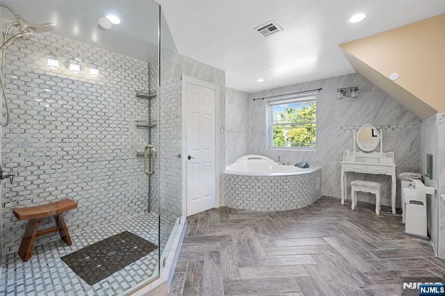 202 Elmwynd Dr, Orange, NJ 07050 - bathroom with tile walls, a stall shower, a garden tub, and recessed lighting