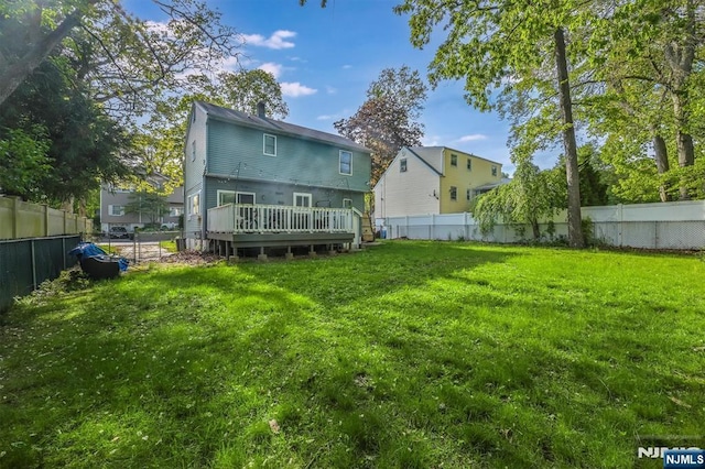 back of house featuring a deck