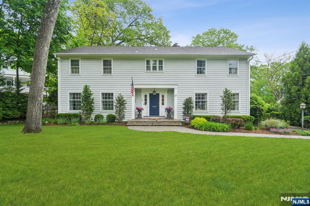 301 W End Ave, Ridgewood, NJ 07450 - colonial house featuring a front lawn