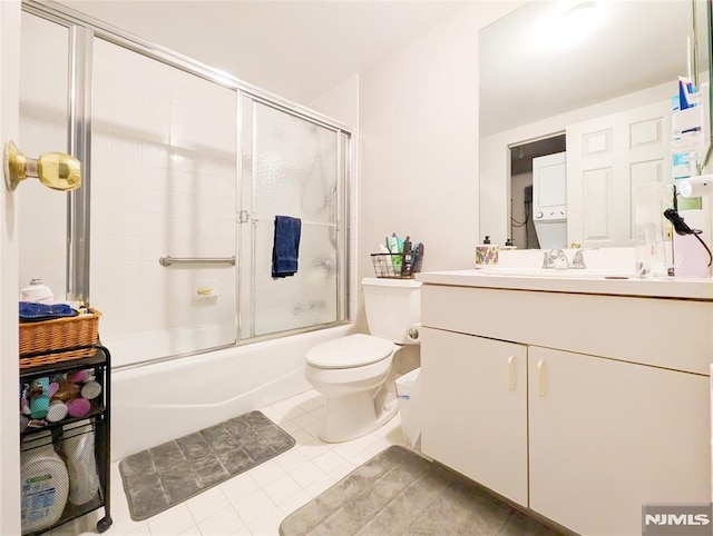 300 Main St Unit 216, Little Falls, NJ 07424 - full bathroom featuring tile patterned flooring, toilet, vanity, and enclosed tub / shower combo