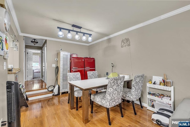 548 Windsor Dr Unit 548, Palisades Park, NJ 07650 - dining area with wood finished floors, ornamental molding, and baseboards