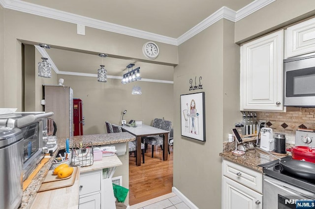 548 Windsor Dr Unit 548, Palisades Park, NJ 07650 - kitchen featuring stainless steel appliances, tasteful backsplash, crown molding, white cabinets, and baseboards