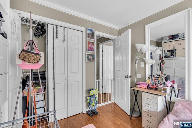 548 Windsor Dr Unit 548, Palisades Park, NJ 07650 - bedroom featuring wood finished floors, ornamental molding, and a closet