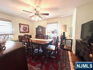 dining area with a ceiling fan and wood finished floors