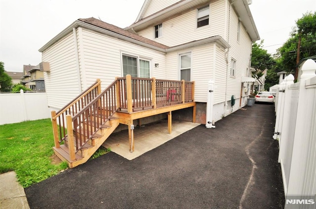 79 Arthur St, Ridgefield Park, NJ 07660 - back of property featuring fence and a deck