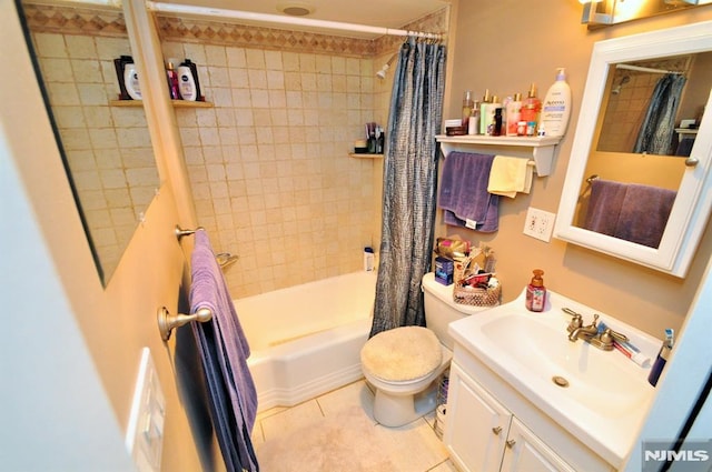 79 Arthur St, Ridgefield Park, NJ 07660 - bathroom featuring shower / tub combo, toilet, vanity, and tile patterned flooring
