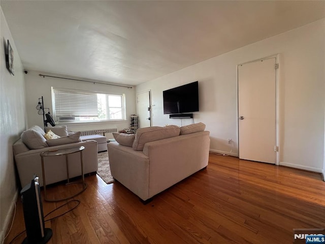 2430 8th St Unit 5B, Fort Lee, NJ 07024 - living area featuring wood finished floors, radiator, and baseboards