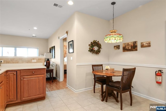 dining space featuring recessed lighting and baseboards