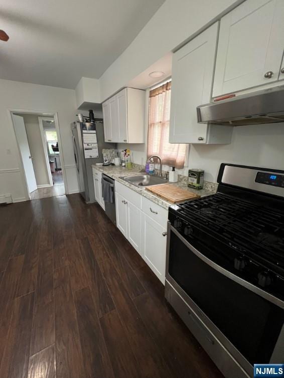 247 Ramapo Valley Rd, Oakland, NJ 07436 - kitchen with appliances with stainless steel finishes, a sink, under cabinet range hood, light countertops, and dark wood finished floors