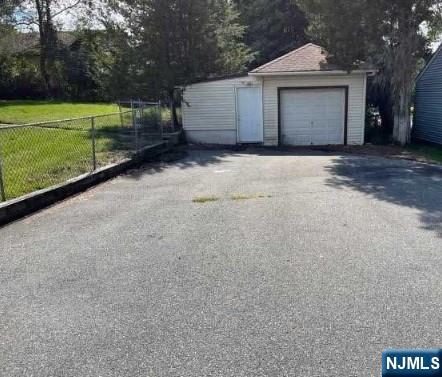 247 Ramapo Valley Rd, Oakland, NJ 07436 - detached garage featuring asphalt driveway