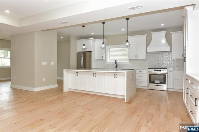 14 Charles Ter, Waldwick, NJ 07463 - kitchen featuring appliances with stainless steel finishes, custom exhaust hood, decorative backsplash, light wood finished floors, and recessed lighting