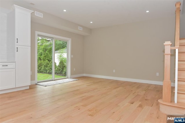 14 Charles Ter, Waldwick, NJ 07463 - spare room with light wood finished floors, recessed lighting, baseboards, and stairway