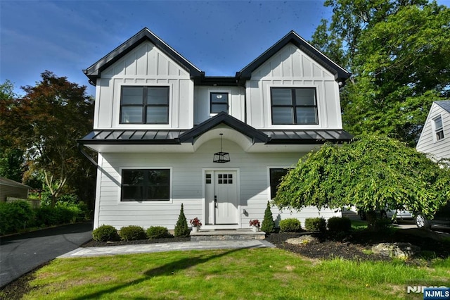 14 Charles Ter, Waldwick, NJ 07463 - view of front facade featuring a standing seam roof, board and batten siding, and metal roof