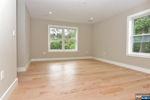 14 Charles Ter, Waldwick, NJ 07463 - spare room featuring healthy amount of natural light, light wood finished floors, baseboards, and recessed lighting