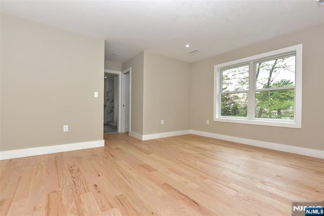 14 Charles Ter, Waldwick, NJ 07463 - spare room with baseboards and light wood-style flooring
