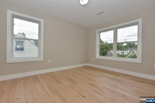 14 Charles Ter, Waldwick, NJ 07463 - spare room with plenty of natural light, wood finished floors, and baseboards